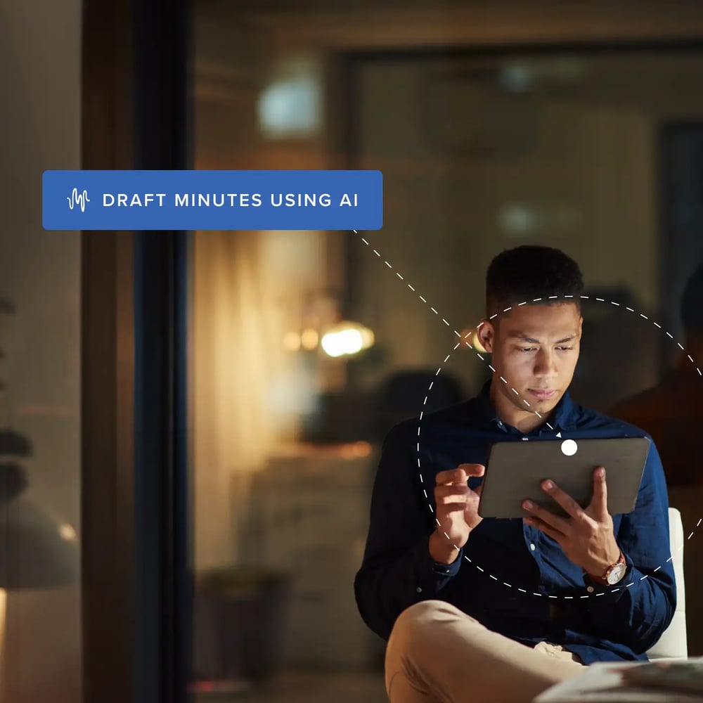 Business professional drafting meeting minutes on laptop